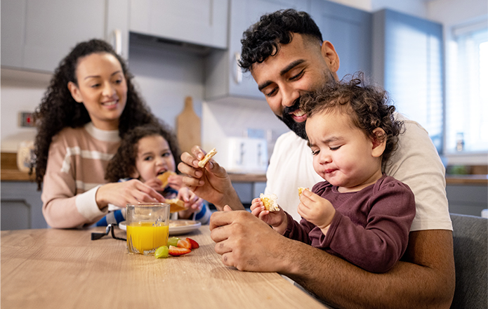 family sitting around the kitchen table