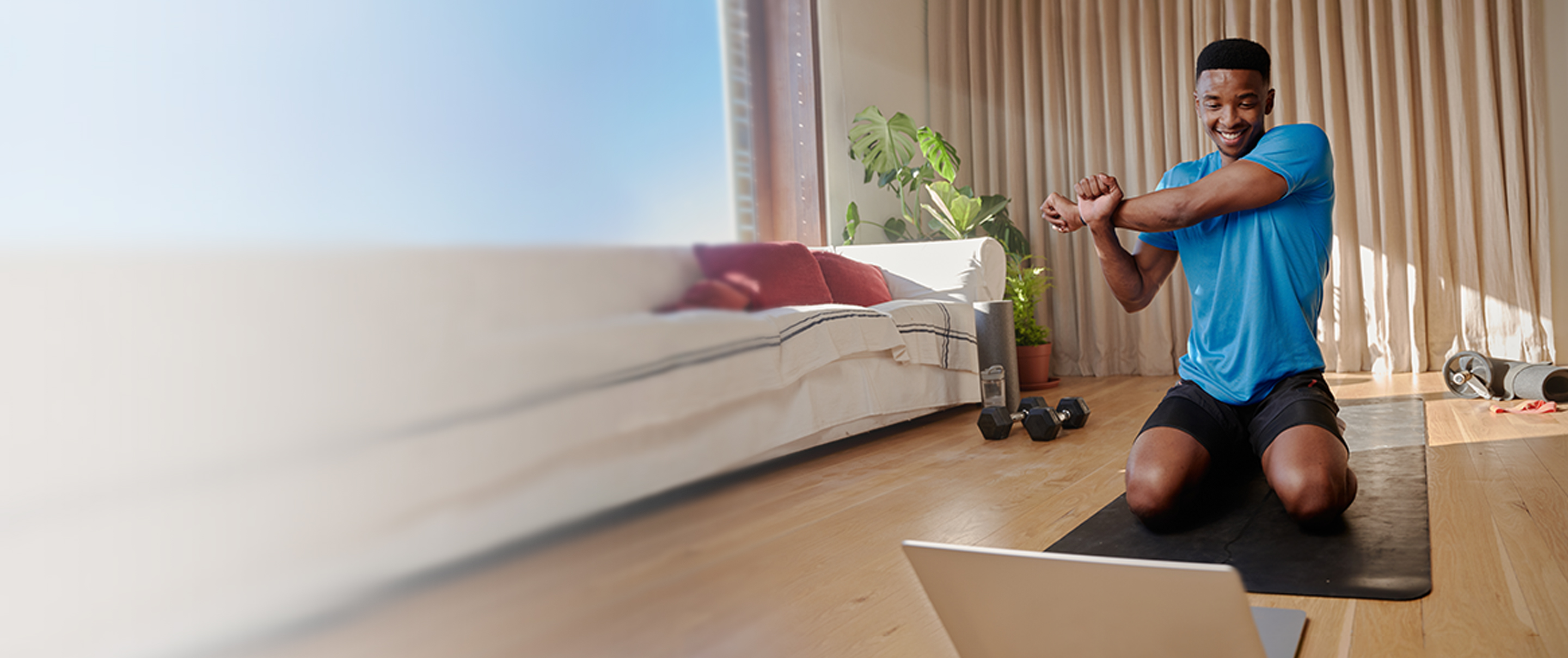 man stretching on a yoga mat