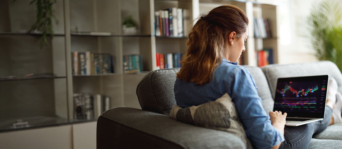 Woman on her laptop looking at stock options